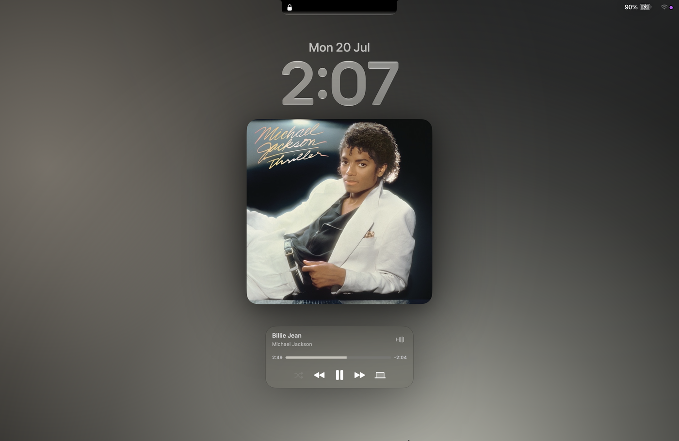 A Mac lock screen with Knotch's expanded album art filling the space above the music widget.